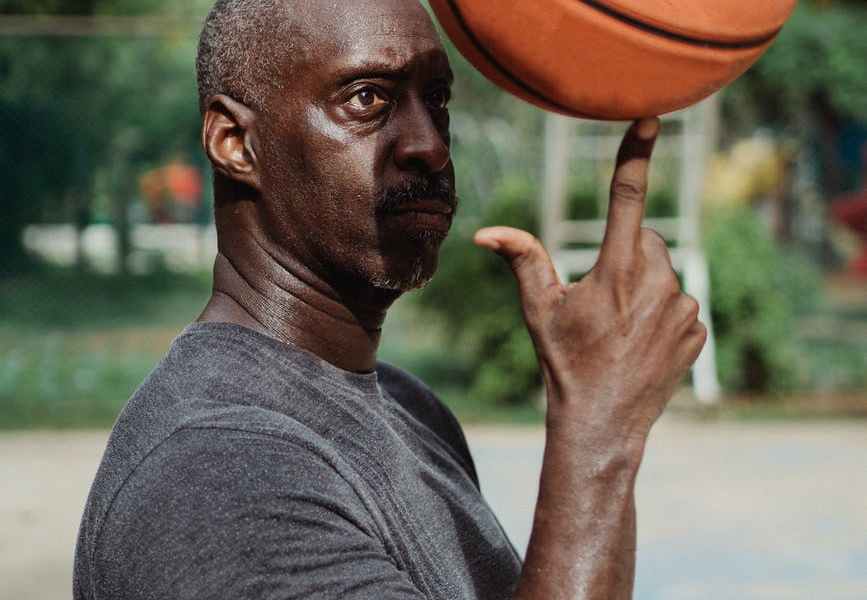 man holding ball on finger
